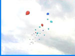 Balloon releases into cloudy sky